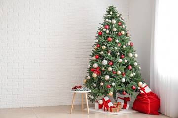 Interior of living room with Santa bag, gifts and beautiful Christmas tree