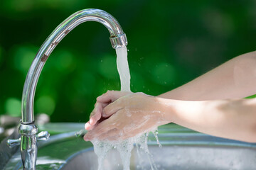 Hands open for drinking tap water. Pouring fresh healthy drink. Good habit. Right choice. Child...