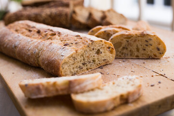 fresh loaf of bread on wooden board