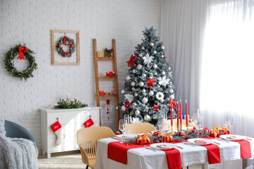 Beautiful table setting with Christmas decorations in living room