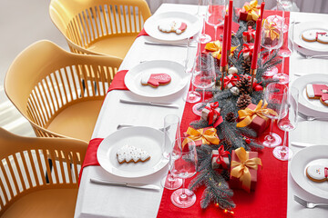 Beautiful table setting with Christmas decorations in living room