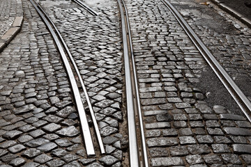 Tram tracks in cobblestone street with missing switch link, Lisbon, Portugal