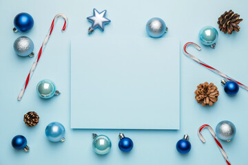 Beautiful Christmas composition with blank card on color background