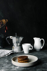 Hot espresso and milk on black table on focus and light in background