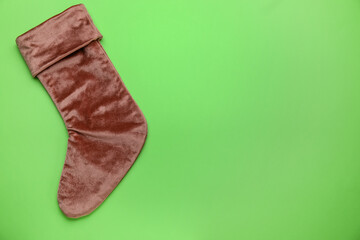 Christmas sock on color background