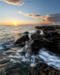 waves and storm during a sunrise 