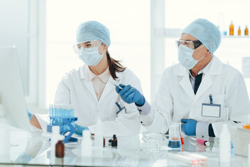 close up. scientists using a computer in a medical laboratory.