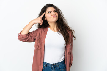 Fototapeta premium Teenager Russian girl isolated on white background making the gesture of madness putting finger on the head