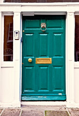 A typical green painted georgian wooden door in the Merrion Square neighborhood