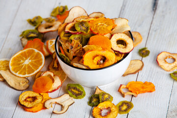 Organic Healthy Assorted Dried Fruit Mix close up. Dried fruit snacks. dried apples, mango, feijoa, dried apricots, prunes top view