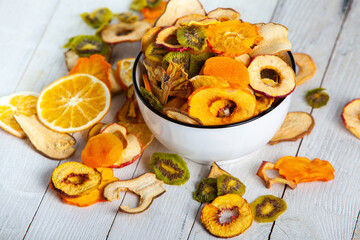 Organic Healthy Assorted Dried Fruit Mix close up. Dried fruit snacks. dried apples, mango, feijoa, dried apricots, prunes top view