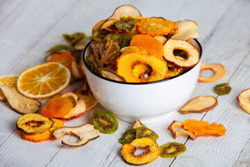 Organic Healthy Assorted Dried Fruit Mix close up. Dried fruit snacks. dried apples, mango, feijoa, dried apricots, prunes top view