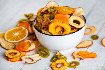 Organic Healthy Assorted Dried Fruit Mix close up. Dried fruit snacks. dried apples, mango, feijoa, dried apricots, prunes top view