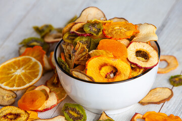 Organic Healthy Assorted Dried Fruit Mix close up. Dried fruit snacks. dried apples, mango, feijoa, dried apricots, prunes top view