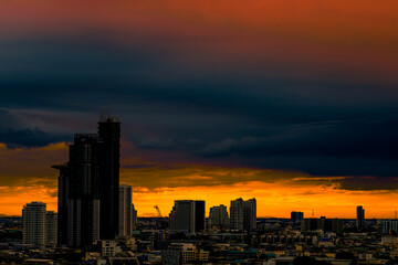 The high angle background of the city view with the secret light of the evening, blurring of night lights, showing the distribution of condominiums, dense homes in the capital community