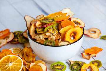 Organic Healthy Assorted Dried Fruit Mix close up. Dried fruit snacks. dried apples, mango, feijoa, dried apricots, prunes top view