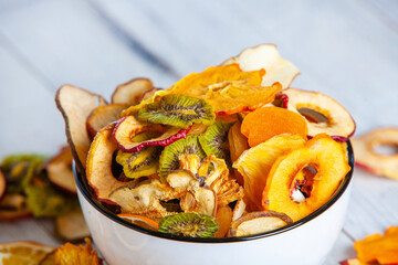 Organic Healthy Assorted Dried Fruit Mix close up. Dried fruit snacks. dried apples, mango, feijoa, dried apricots, prunes top view