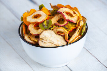 Organic Healthy Assorted Dried Fruit Mix close up. Dried fruit snacks. dried apples, mango, feijoa, dried apricots, prunes top view