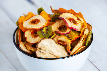 Organic Healthy Assorted Dried Fruit Mix close up. Dried fruit snacks. dried apples, mango, feijoa, dried apricots, prunes top view