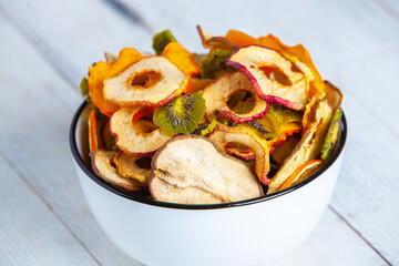 Organic Healthy Assorted Dried Fruit Mix close up. Dried fruit snacks. dried apples, mango, feijoa, dried apricots, prunes top view