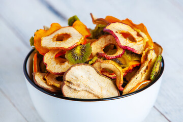 Organic Healthy Assorted Dried Fruit Mix close up. Dried fruit snacks. dried apples, mango, feijoa, dried apricots, prunes top view