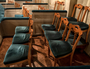 the interior of the theater, corridors in the foyer, armchairs and chandeliers in the hall.
