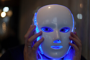 Artificial intelligence- A man with a mask on his face, half man half robot