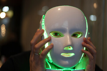 Artificial intelligence- A man with a mask on his face, half man half robot