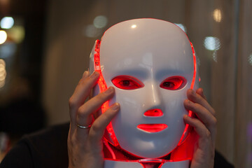 Artificial intelligence- A man with a mask on his face, half man half robot