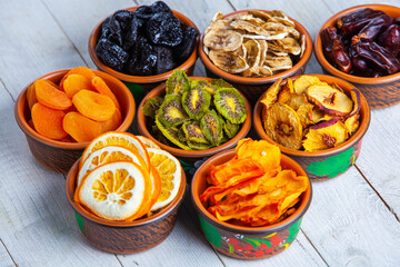 Organic Healthy Assorted Dried Fruit Mix close up. Dried fruit snacks. dried apples, mango, feijoa,...