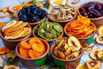 Organic Healthy Assorted Dried Fruit Mix close up. Dried fruit snacks. dried apples, mango, feijoa, dried apricots, prunes top view