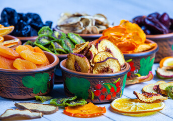 Organic Healthy Assorted Dried Fruit Mix close up. Dried fruit snacks. dried apples, mango, feijoa, dried apricots, prunes top view