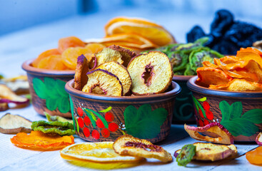 Organic Healthy Assorted Dried Fruit Mix close up. Dried fruit snacks. dried apples, mango, feijoa, dried apricots, prunes top view