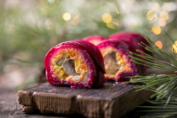 Shuba salad. Russian layered salad with beet, potato, carrot, pickled herring and mayonnaise for Christmas dinner.