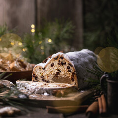 Christmas stollen on wooden background. Traditional Christmas festive pastry dessert. Stollen for Christmas