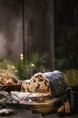 Christmas stollen on wooden background. Traditional Christmas festive pastry dessert. Stollen for Christmas