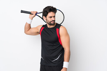 Fototapeta na wymiar Young handsome man with beard over isolated white background playing tennis