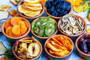 Organic Healthy Assorted Dried Fruit Mix close up. Dried fruit snacks. dried apples, mango, feijoa, dried apricots, prunes top view