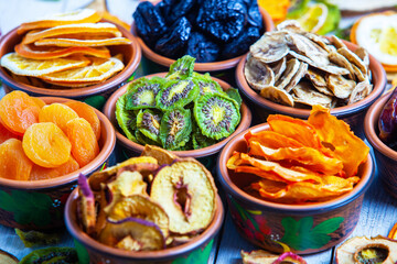 Organic Healthy Assorted Dried Fruit Mix close up. Dried fruit snacks. dried apples, mango, feijoa, dried apricots, prunes top view