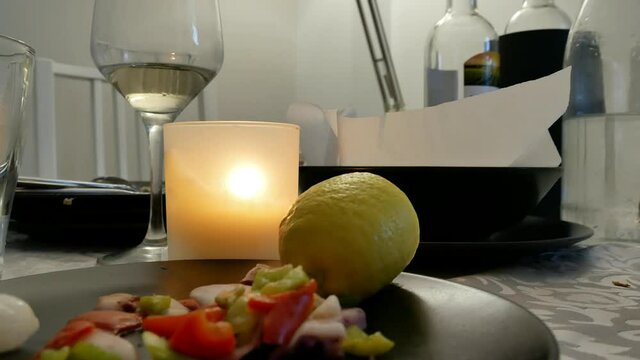BODEGON ON TABLE BEFORE DINNER WITH A GLASS OF WHITE WINE