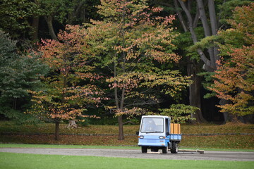 The grass field caretakers with the pick-up car in Sapporo Japan