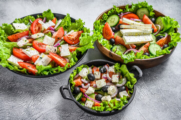 Set of ready-to-eat Greek salad in a bowl. White background. Top view