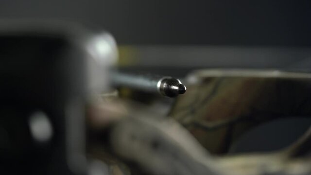 focus and movement from the tip of the arrow to the aiming device on the crossbow