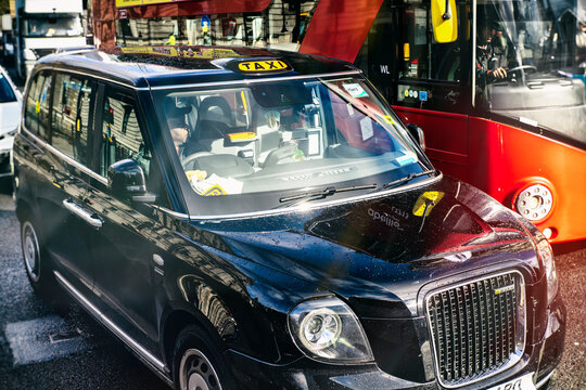 LONDON - MARCH 2, 2020:traditional taxi on a city street, blurred image