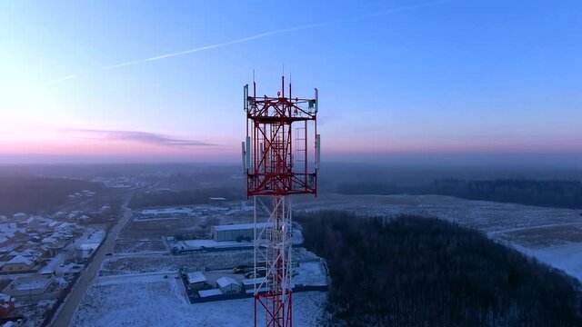 Aerial view panoramic landscape of cell towers at dawn in winter. Telecommunications and Communications Industry Infrastructure