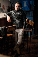 Portrait of a handsome young man. Shooting in a bar