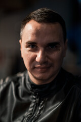 Fototapeta premium Portrait of a handsome young man. Shooting in a bar