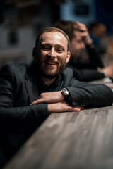 Fototapeta premium Portrait of a handsome young man. Shooting in a bar