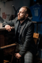 Portrait of a handsome young man. Shooting in a bar