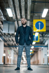 Portrait of a handsome young man. Shooting in a car park